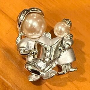 AJC Vintage Brooch-  pearl faced woman reading to child Silver Toned